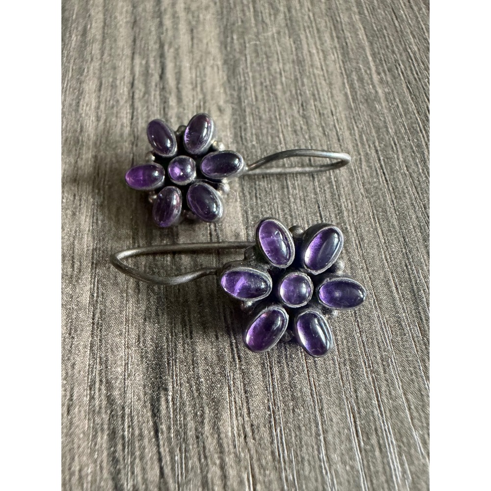 Indian sterling silver with amethyst cabochons.